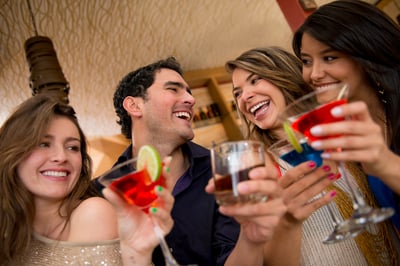 Friends having drinks at the club looking very happy