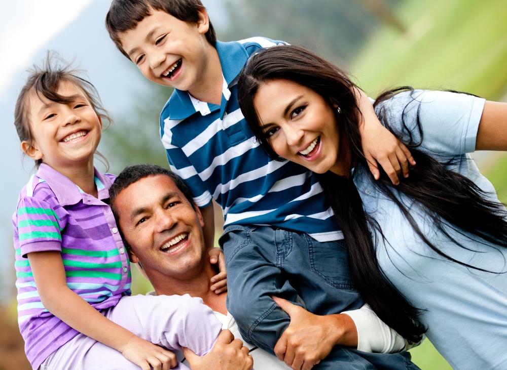 Happy family having fun outdoors and smiling