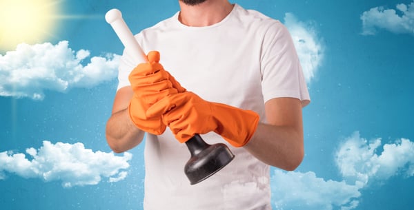 Sunny and cloudy concept with male housekeeper and orange gloves on his hand