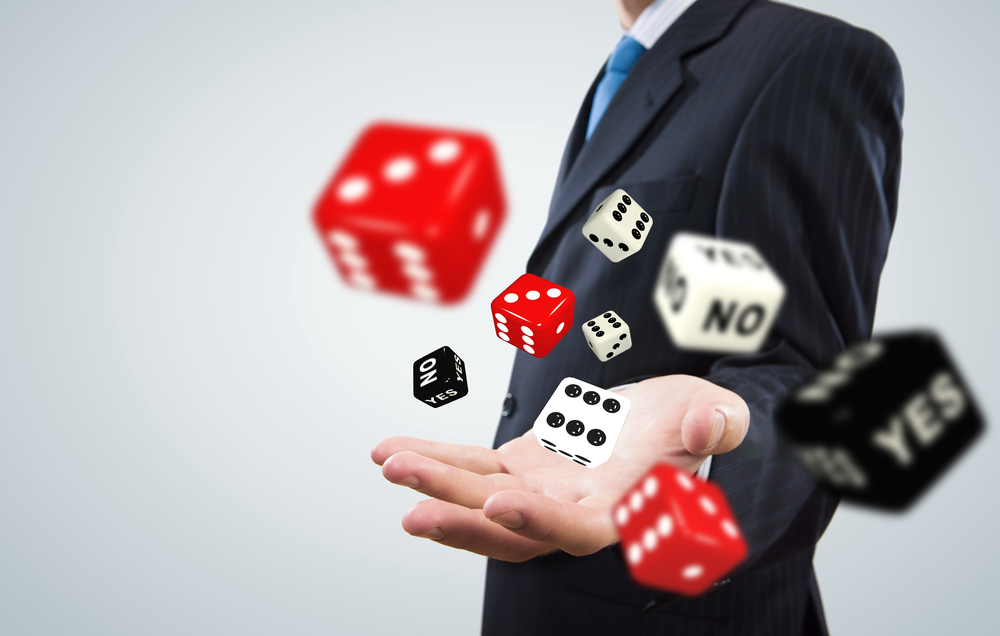 Close up of businessman throwing dice. Gambling concept-1