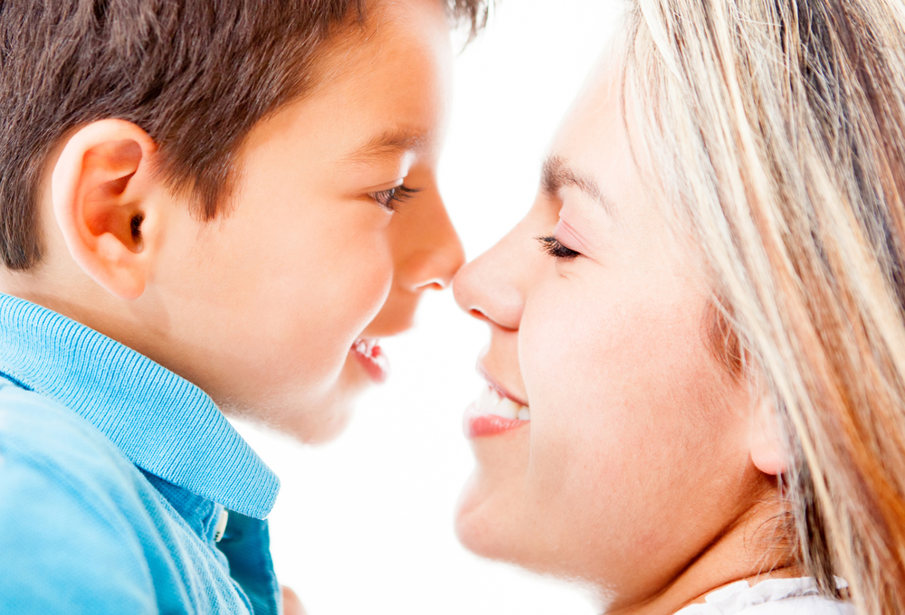 Portrait of a mother and son - isolated over a white background